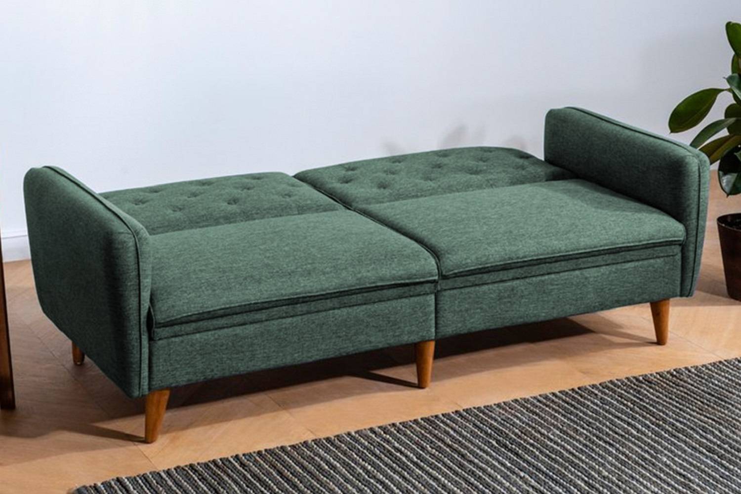 Sofahouse Designová rozkládací sedačka Kaloni 202 cm zelená